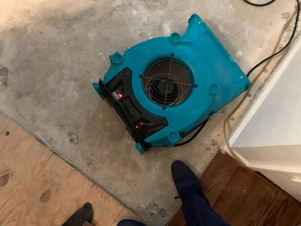 Air mover drying subfloor during Leak Detection & Repair in Delran